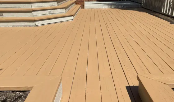 Calgary deck freshly coated in a warm solid stain with matching steps and planter boxes