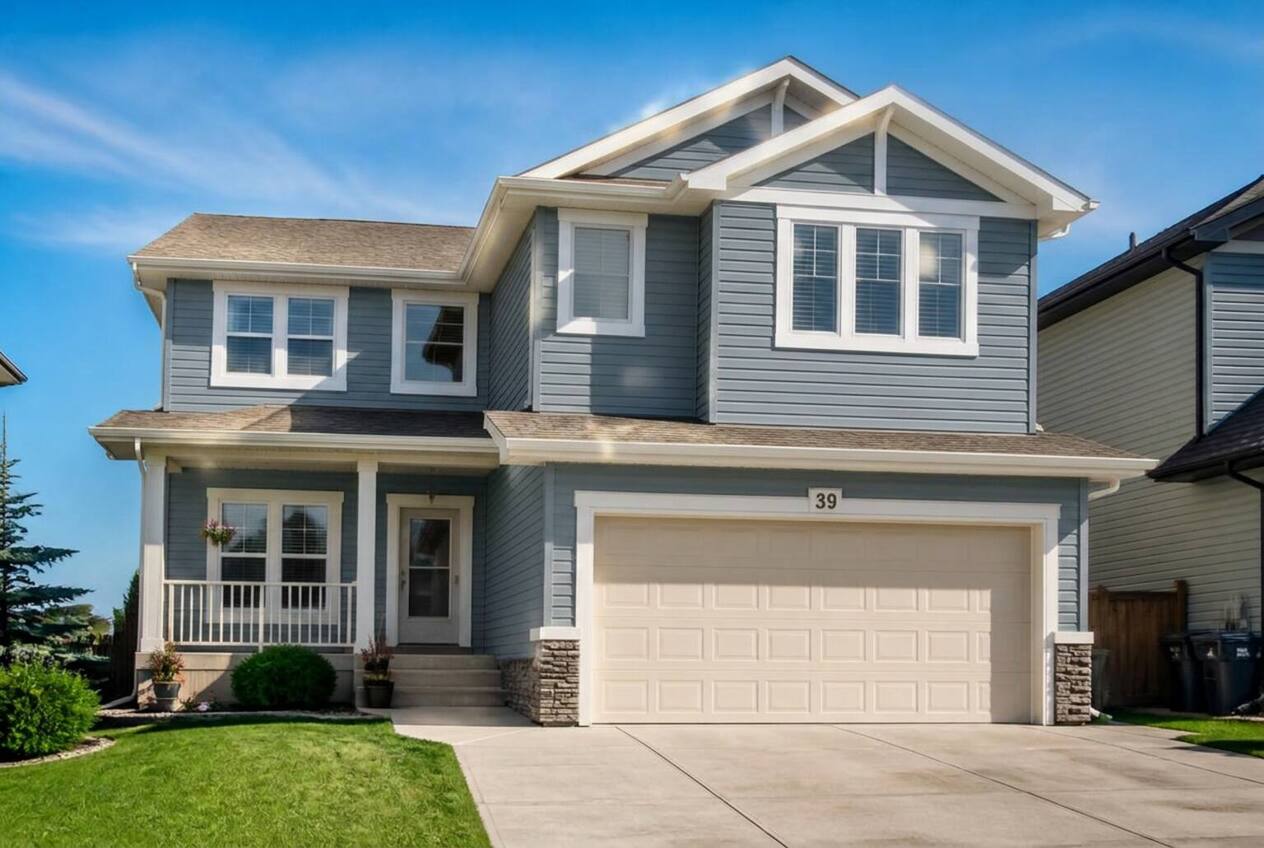 The same house with siding repainted in Foothills Blue