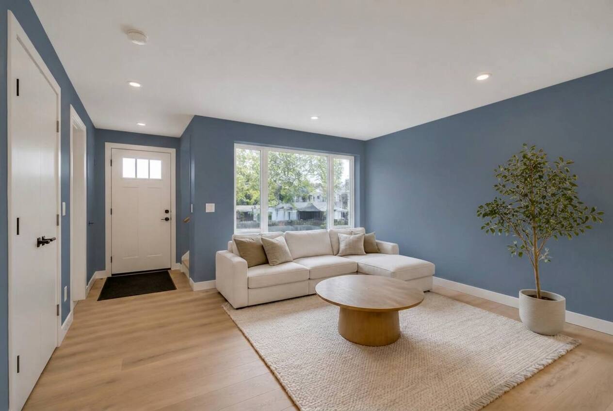 The same living room with walls repainted in Elbow Blue